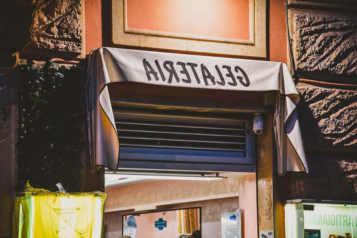 awning white and black Gelateria signage canopy